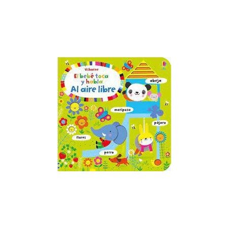 El bebé toca y habla al aire libre
